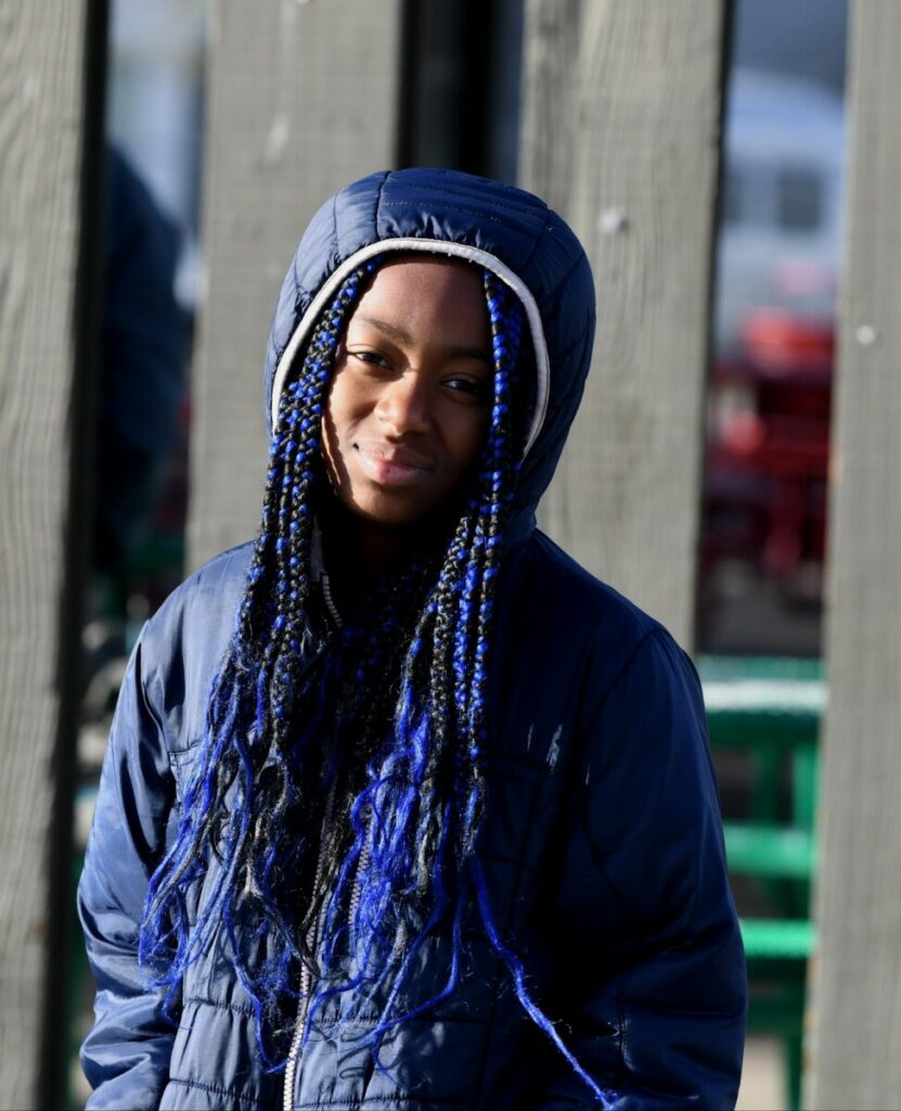 San Diego Cooperative tuition-free charter school student smiling in blue jacket